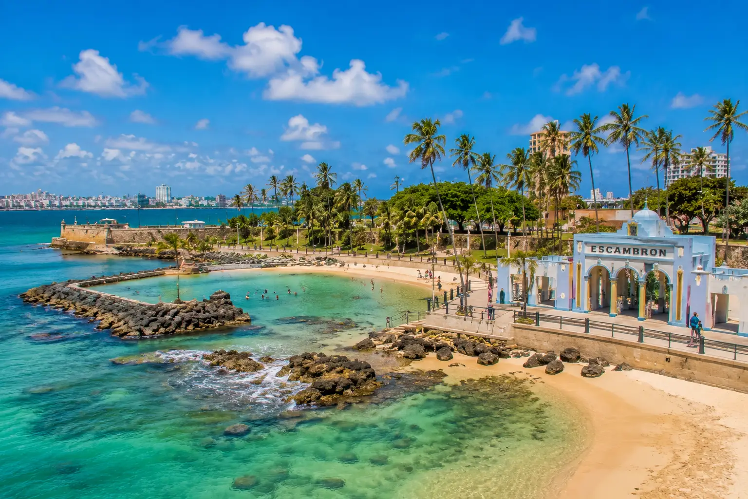Turquoise water, rocky coves and palm-lined paths surround Balneario El Escambrón in San Juan.