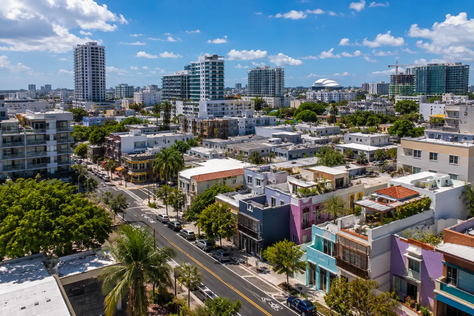An aerial view shows low-rise homes, apartment towers and tree-lined streets in Santurce, San Juan.