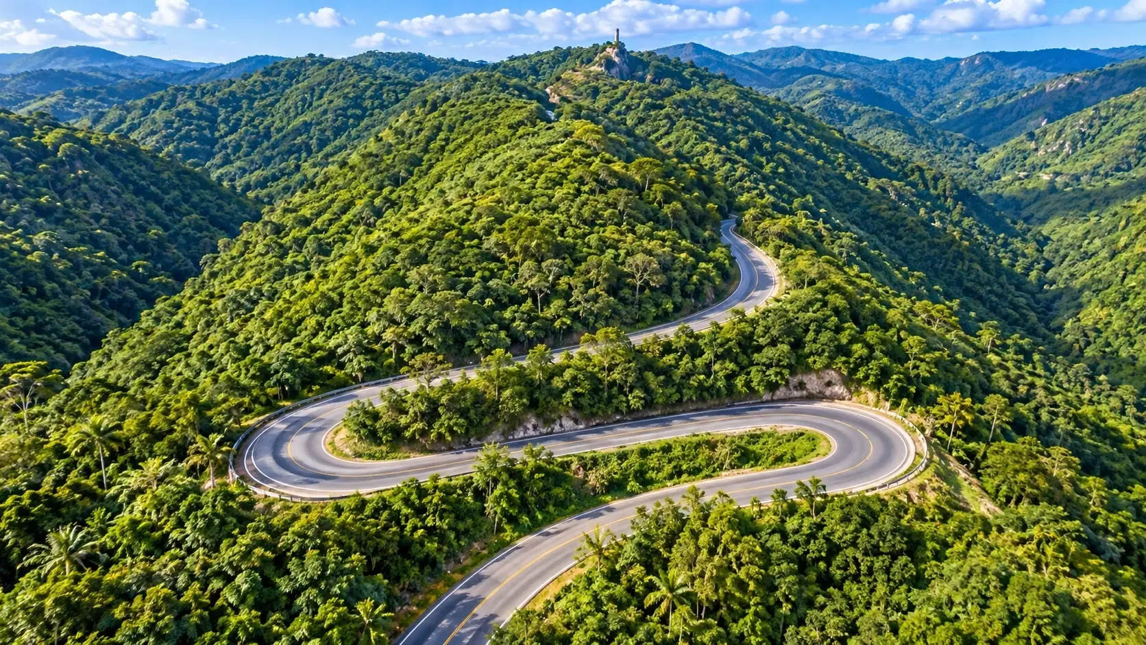 Scenic winding mountain roads surrounded by lush green hills in Aibonito, Puerto Rico.