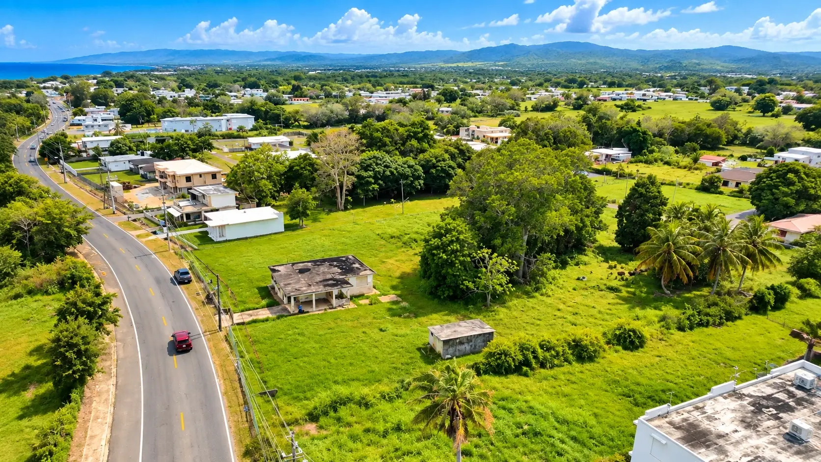 Illustrative Camaceyes view with homes, green parcels, roads and palm trees.