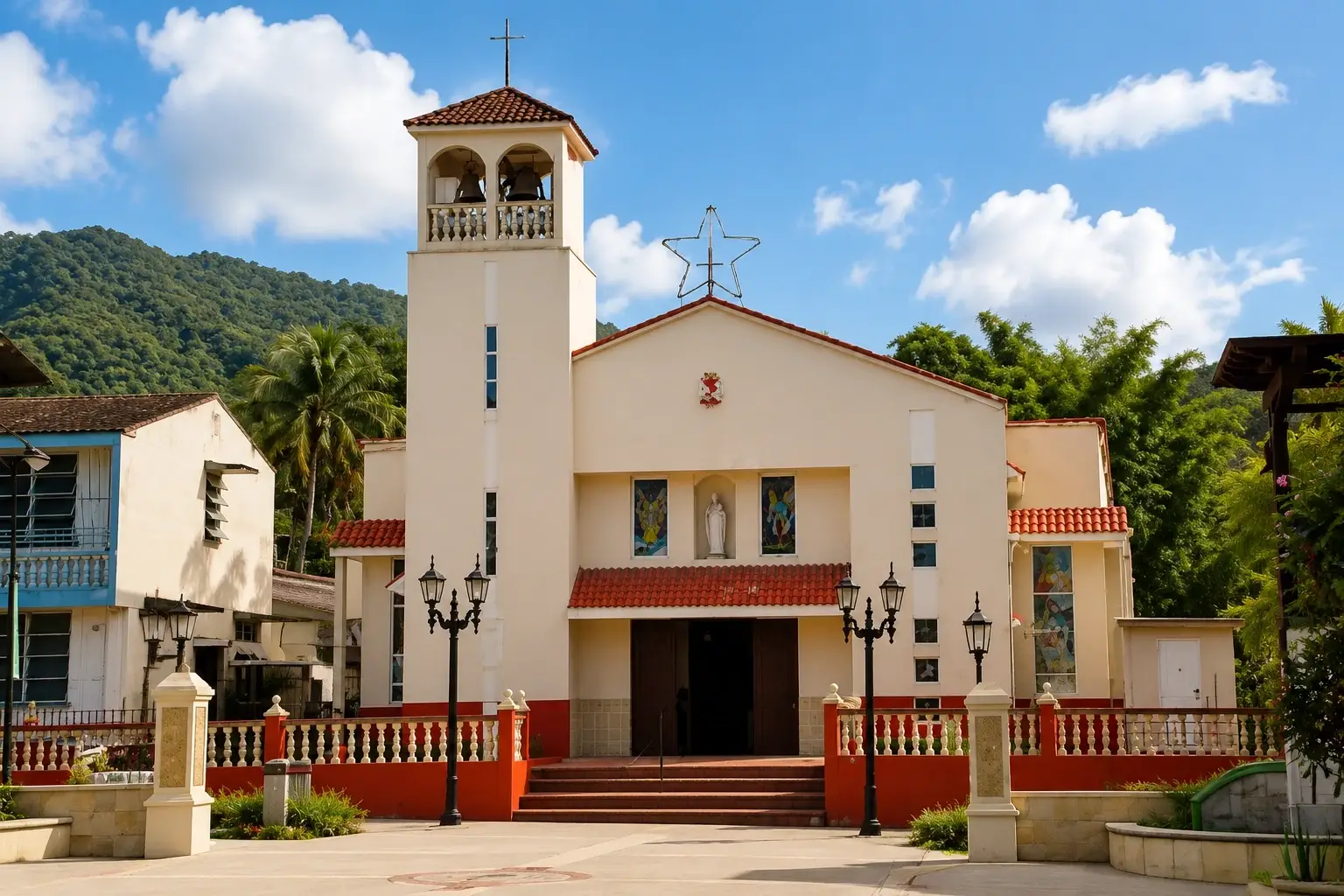 Exterior of Parroquia San Joaquín y Santa Ana with bell tower, traditional façade, and green mountain backdrop in Adjuntas, Puerto Rico.